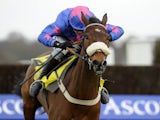 Joe Tizzard riding Cue Card clear the last to win The Betfair Ascot Steeple Chase at Ascot racecourse on February 16, 2013