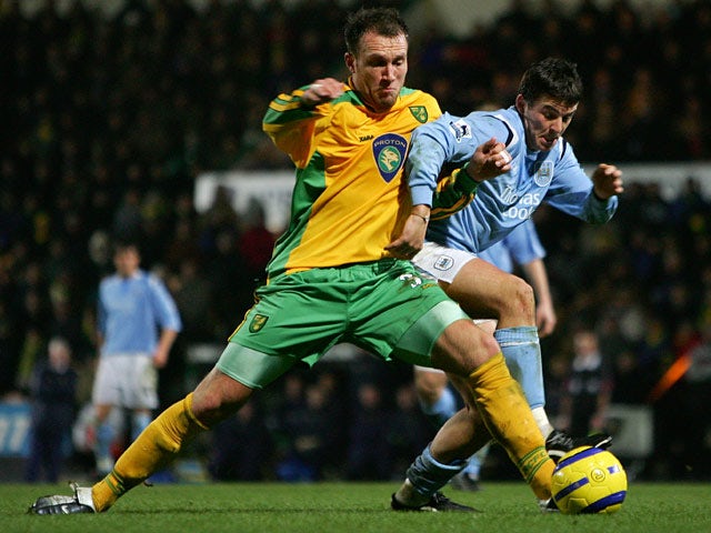 Man City's Stephan Jordan and Norwich Dean Ashton in action during their Premier League match on February 28, 2005