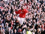Dwight Yorke celebrates scoring for Manchester United against Arsenal on February 25, 2001.