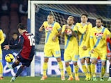 Genoa's Italian forward Emanuele Calaio (L) kicks to score a free kick during the Italian Serie A football match SSC Napoli vs Genoa CFC at San Paolo Stadium in Naples on February 24, 2014