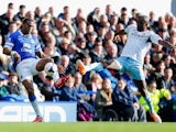 Sylvain Distin of Everton is challenged by Carlton Cole of West Ham United during the Barclays Premier League match between Everton and West Ham United at Goodison Park on March 1, 2014