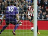 Sunderland striker Fabio Borini scores the opening goal past Manchester City goalkeeper Costel Pantilimon during the League Cup final at Wembley on March 2, 2014