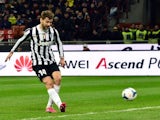 Juventus' Spanish foward Fernando Llorente scores a goal during the Serie A football match between AC Milan and Juventus at San Siro Stadium in Milan on March 02, 2014