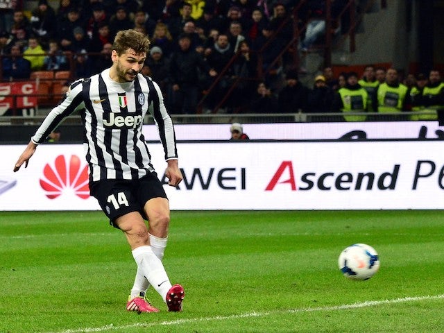 Juventus' Spanish foward Fernando Llorente scores a goal during the Serie A football match between AC Milan and Juventus at San Siro Stadium in Milan on March 02, 2014