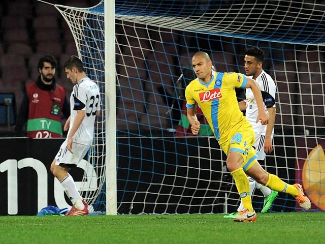 Napoli's Gokhan Inler celebrates after scoring his team's third goal against Swansea during their Europa League match on February 27, 2014