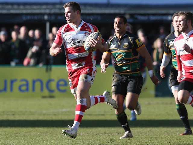 Henry Trinder of Gloucester breaks clear for a try during the Aviva Premiership match between Northampton Saints and Gloucester at Franklin's Gardens on March 1, 2014