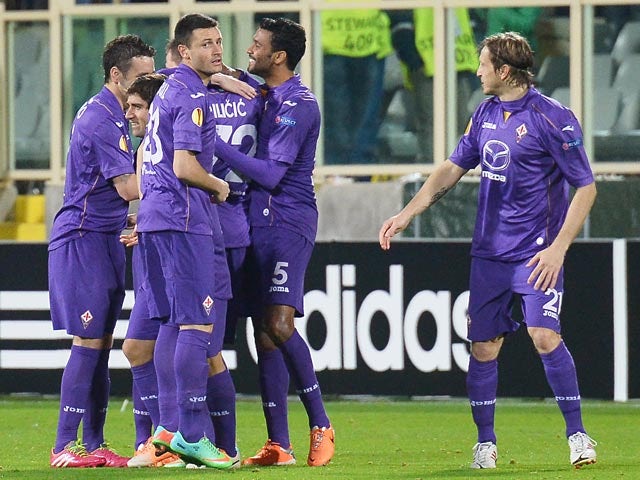 Fiorentina's Josip Ilicic celebrates with teammates after scoring the opening goal against Esbjerg during their Europa League match on February 27, 2014