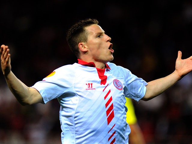 Sevilla's Kevin Gameiro celebrates after scoring his team's second goal against Maribor during their Europa League match on February 27, 2014