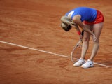 Czech Republic's Klara Zakopalova reacts to play after missing a point against Spain's Carla Suarez Navarro during their 2014 International Tennis Federation Fed Cup World Group first-round tie at the Blas Infante tennis centre in Sevilla on February 10, 