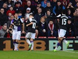 Luis Suarez of Liverpool celebrates scoring the opening goal during the Barclays Premier League match between Southampton and Liverpool at St Mary's Stadium on March 1, 2014