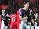 Liverpool's English midfielder Steven Gerrard celebrates after scoring his team's third goal during the English Premier League football match between Southampton and Liverpool at St Mary's Stadium in Southampton, southern England on March 1, 2014