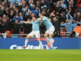 Samir Nasri of Manchester City celebrates his goal with Edin Dzeko during the Capital One Cup Final between Manchester City and Sunderland at Wembley Stadium on March 2, 2014