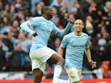 Yaya Toure of Manchester City celebrates his goal with Pablo Zabaleta of Manchester City during the Capital One Cup Final between Manchester City and Sunderland at Wembley Stadium on March 2, 2014