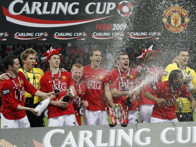 Manchester United players celebrate winning the League Cup on March 1, 2009.