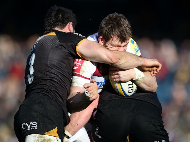 Mark Cueto of Sale Sharks is tackled by Wasps pair Matt Mullan (R) and Andrea Masi (L) during the Aviva Premiership match on March 1, 2014