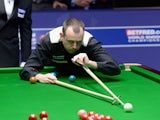 Mark Williams plays a shot in his second round match against Ronnie O'Sullivan during The Betfred.com World Snooker Championship at Crucible Theatre on April 30, 2012