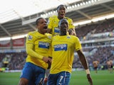 Moussa Sissoko of Newcastle United celebrates with Loic Remy after scoring their third goal during the Barclays Premier League match between Hull City and Newcastle United at KC Stadium on March 1, 2014