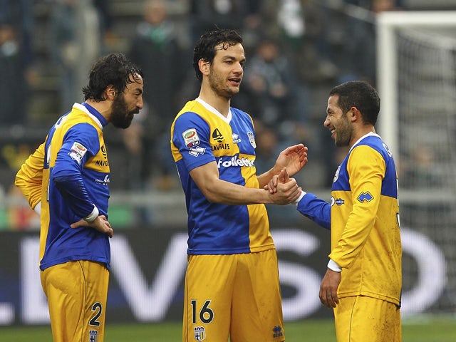 Marco Parolo, Mattia Cassani and Walter Gargano of Parma FC celebrate their victory at the end of the Serie A match between US Sassuolo Calcio and Parma FC on March 2, 2014