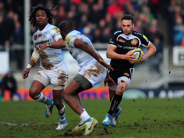 Exeter centre Phil Dollman (r) makes a break past Marland Yarde (l) and Topsy Ojo of London Irish during the Aviva Premiership match on March 1, 2014