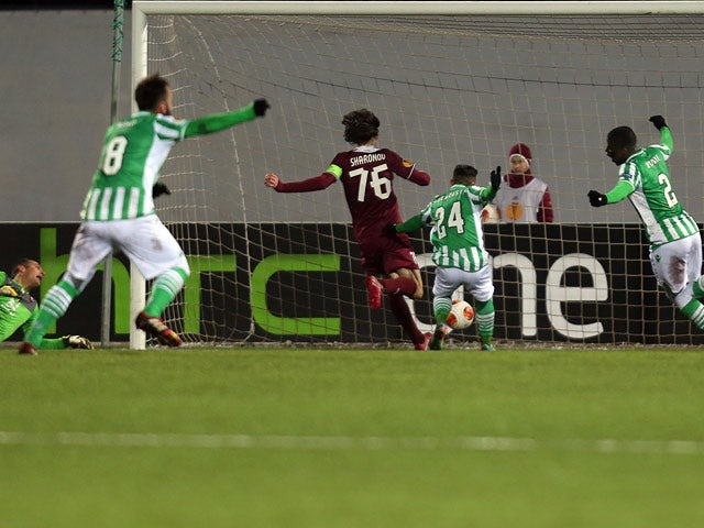 Real Betis' players celebrate after scoring a goal against Rubin Kazan during their Europa League match on February 27, 2014