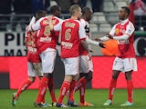 Reims' players celebrate after Nicolas de Preville scored a goal during the French football match between Reims and Valenciennes on March 1, 2014