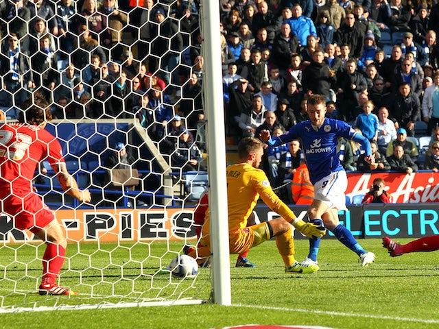 Leicester City's Jamie Vardy scores the opener past Charlton Athletic's Ben Hamer during the Sky Bet Championship match against Charlton Athletic on March 1, 2014