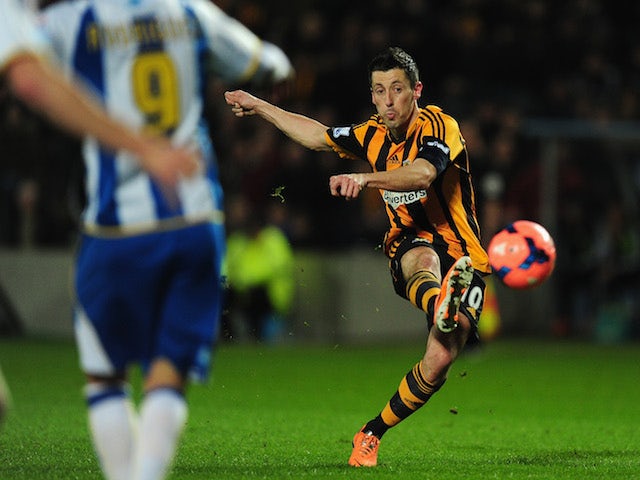 Hull player Robert Koren scores the second goal from a free kick during the FA Cup Fifth round replay against Brighton & Hove Albion on February 24, 2014