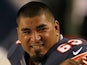 Roberto Garza #63 of the Chicago Bears talks with a teammate on the bench during a game against the Cleveland Browns at Soldier Field on August 29, 2013