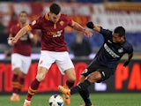 Kevin Strootman of AS Roma competes for the ball with Guarin of FC Internazionale Milano during the Serie A match between AS Roma and FC Internazionale Milano at Stadio Olimpico on March 1, 2014