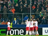 Salzburg's teammates celebrate their goal against Ajax during their Europa League match on February 27, 2014