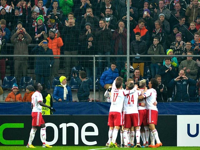 Salzburg's teammates celebrate their goal against Ajax during their Europa League match on February 27, 2014