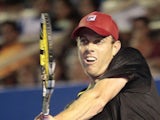 Sam Querrey of USA returns the ball to Tigre Hank of Mexico during the Mexico ATP Open men's single tennis match, in Acapulco, Guerrero state, Mexico on February 24, 2014