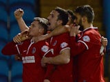 Simon Church (L) of Charlton Athletic celebrates scoring with team mates during the Budweiser FA Cup Fifth Round match against Sheffield Wednesday on February 24, 2014
