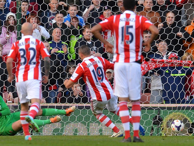 Stoke City's Irish forward Jon Walters scores a penalty for the opening goal during the English Premier League football match between Stoke City and Arsenal at the Britannia Stadium in Stoke-on-Trent on March 1, 2014