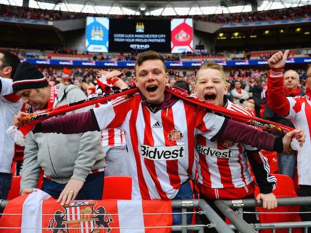 Young Sunderland fans cheer prior to the Capital One Cup Final between Manchester City and Sunderland at Wembley Stadium on March 2, 2014