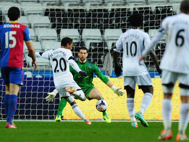 Swansea player Jonathan de Guzman opens the scoring during the Barclays Premier League match between Swansea City and Crystal Palace at Liberty Stadium on March 2, 2014