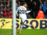 Jonathan de Guzman of Swansea City celebrates scoring the opening goal during the Barclays Premier League match between Swansea City and Crystal Palace at Liberty Stadium on March 2, 2014