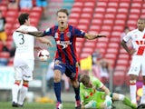 Newcastle Jets' Adam Taggart celebrates after scoring the opening goal against Melbourne Heart during their A-League match on March 8, 2014