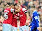 Arsenal's German midfielder Mesut Ozil celebrates scoring the opening goal with teammate English striker Alex Oxlade-Chamberlain during the English FA Cup quarter final football match between Arsenal and Everton at the Emirates Stadium in London on March 
