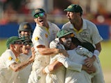 Australian players celebrate after winning the game during day 5 of the third test match between South Africa and Australia at Sahara Park Newlands on March 5, 2014