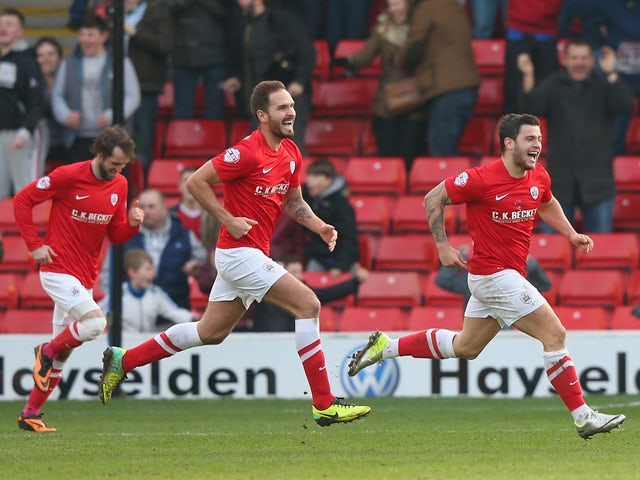 Dale Jennings of Barnsley celebrates after scoring the opening goal during the Sky Bet Championship match between Barnsley and Nottingham Forest at Oakwell on March 08, 2014
