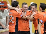 Brisbane's Besart Berisha celebrates with teammates after scoring against Adelaide in their A-League match on March 9, 2014