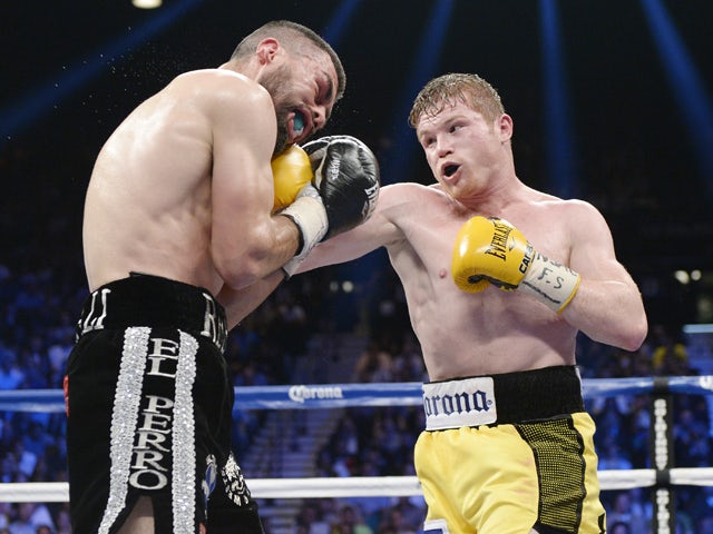 Canelo Alvarez throws a punch against Alfredo Angulo during the non-title, 12-round super welterweight bout at the MGM Grand Garden March 8, 2014