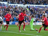 Cardiff City player Steven Caulker celebrates after scoring the opening goal during the Barclays Premier league match between Cardiff City and Fulham at Cardiff City Stadium on March 8, 2014