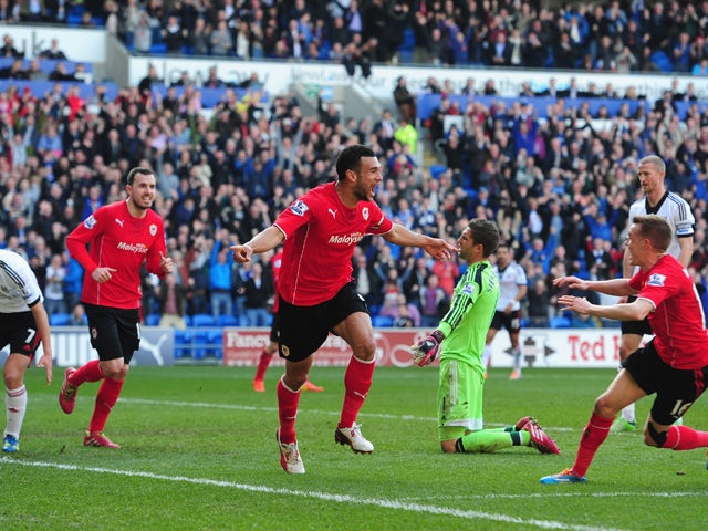 Cardiff City player Steven Caulker celebrates after scoring the opening goal during the Barclays Premier league match between Cardiff City and Fulham at Cardiff City Stadium on March 8, 2014