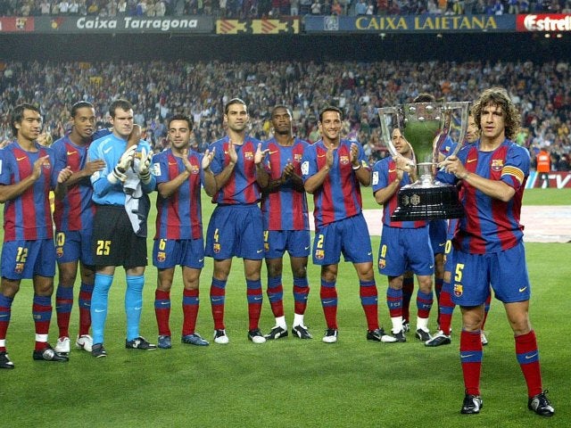 Carles Puyol poses with the La Liga trophy on May 22, 2005.