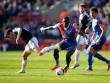 Yannick Bolasie of Crystal Palace takes on Jack Cork of Southampton during the Barclays Premier League match between Crystal Palace and Southampton at Selhurst Park on March 8, 2014