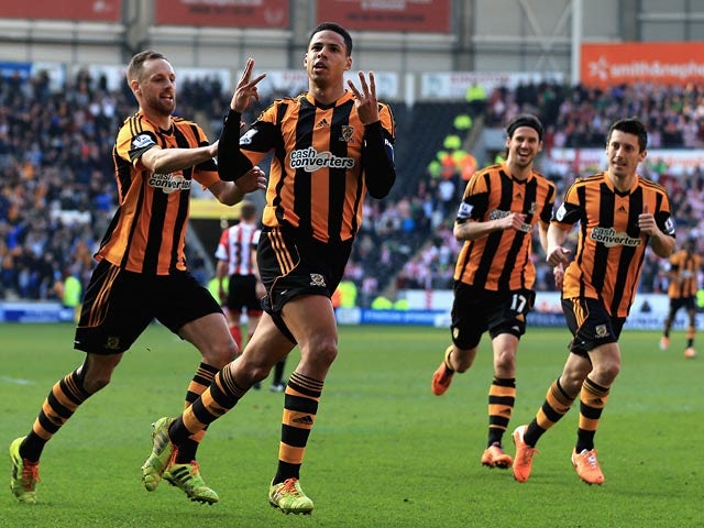 Hull's Curtis Davies celebrates with teammates after scoring the opening goal against Sunderland during their FA Cup quarter-final match on March 9, 2014