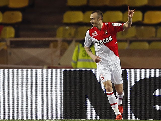 Monaco's Dimitar Berbatov celebrates after scoring the opening goal against Sochaux during their Ligue 1 match on March 8, 2014
