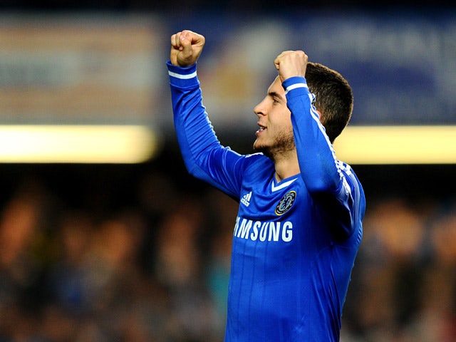 Chelsea's Eden Hazard celebrates after scoring his team's second goal via the penalty spot against Tottenham during their Premier League match on March 8, 2014